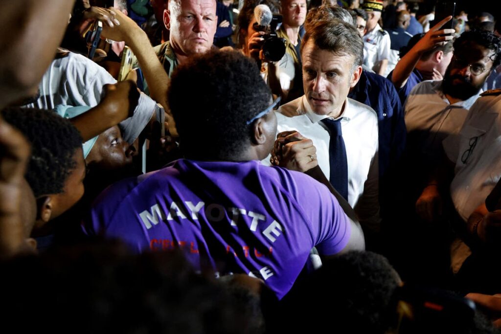 Macron swears during angry exchange with heckling crowd while visiting to cyclone-battered Mayotte