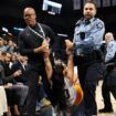 Security guards tackle two women to the ground during Knicks-Timberwolves game after they ran onto court