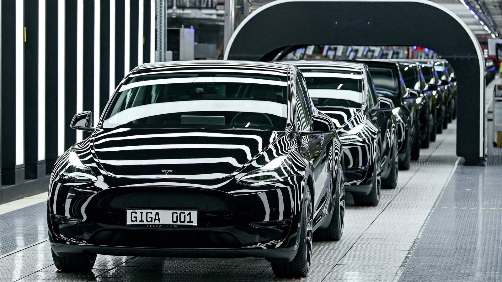 FILE PHOTO: Model Y cars are pictured during the opening ceremony of the new Tesla Gigafactory for electric cars in Gruenheide, Germany, March 22, 2022. Patrick Pleul/Pool via REUTERS/File Photo