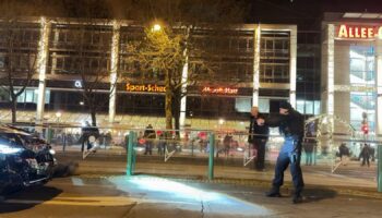 Police officers arrest a suspect at the Christmas market. Pic: Privat/picture-alliance/dpa/AP Images