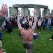 People take part in the winter solstice celebrations during sunrise at the Stonehenge prehistoric monument on Salisbury Plain in Wiltshire. Picture date: Saturday December 21, 2024. PA Photo. See PA story SOCIAL Solstice. Photo credit should read: Andrew Matthews/PA Wire