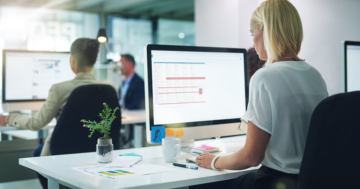 Cropped shot of a group of businesspeople working in the office