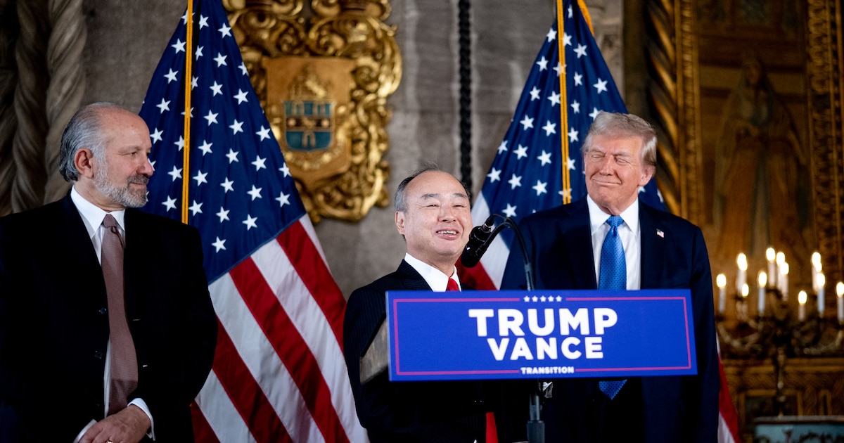 PALM BEACH, FLORIDA - DECEMBER 16: SoftBank CEO Masayoshi Son (C), accompanied by U.S. President-elect Donald Trump (R) and Trump's choice for Secretary of Commerce, Cantor Fitzgerald Chairman and CEO Howard Lutnick (L), speaks at a news conference at Trump's Mar-a-Lago resort on December 16, 2024 in Palm Beach, Florida. In a news conference that went over an hour, Trump announced that SoftBank will invest over $100 billion in projects in the United States including 100,000 artificial intelligence related jobs and then took questions on Syria, Israel, Ukraine, the economy, cabinet picks, and many other topics.   Andrew Harnik/Getty Images/AFP (Photo by Andrew Harnik / GETTY IMAGES NORTH AMERICA / Getty Images via AFP)