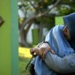 Women comfort each other as they visit a mass grave of victims of the 2004 Indian Ocean tsunami in Banda Aceh, Indonesia. Pic: AP