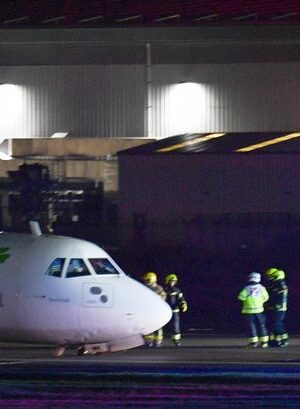 BREAKING: Belfast airport: Plane crash lands as landing gear collapses whilst 82mph winds batter UK