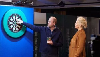 Cider-swigging Prince William channels his inner Luke Littler playing darts with Hannah Waddingham