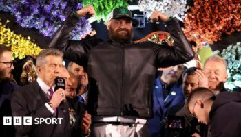 Tyson Fury weighs in, still wearing his clothes including a leather jacket