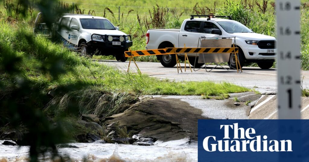 Heavy rain prompts evacuation alerts in Queensland as fires rage in Victoria