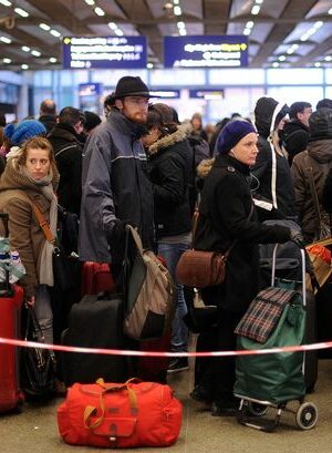 Hundreds of Brits stranded days before Christmas with flights axed as UK lashed by 82mph winds