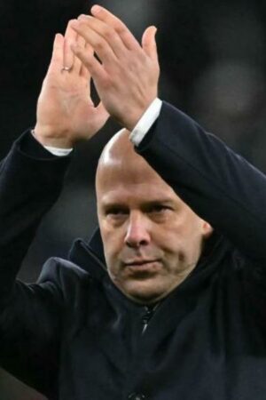 Liverpool Head Coach Arne Slot acknowledges the fans at the end of the emphatic victory at Spurs