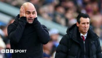 Pep Guardiola holds his hands to his head in despair he as watches his Manchester City side lose at Aston Villa