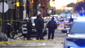 Emergency services attend the scene on Bourbon Street after a vehicle drove into a crowd on New Orleans' Canal and Bourbon Street, Wednesday Jan. 1, 2025. (AP Photo/Gerald Herbert)