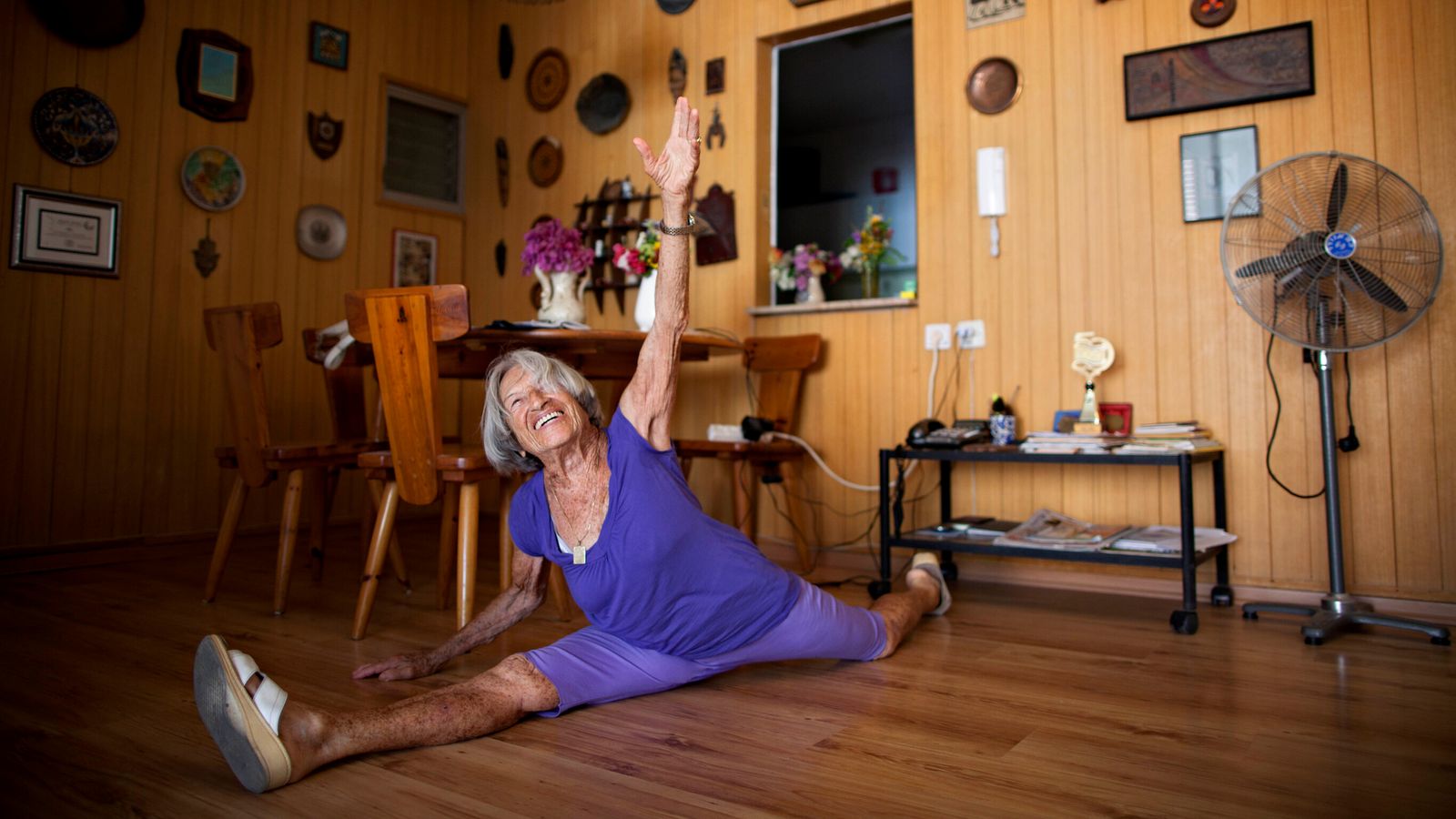 Agnes Keleti, a 91-year-old former Olympic gymnast, performs a split at her house in Herzliya, Israel, Monday, Aug. 13, 2012. Keleti won 10 Olympic medals, including 5 gold medals, while she represented Hungary in the Olympic games of 1948, 1952, and 1956. (AP Photo/Oded Balilty)