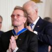 President Joe Biden presents Bono with the Presidential Medal of Freedom. Pic: AP