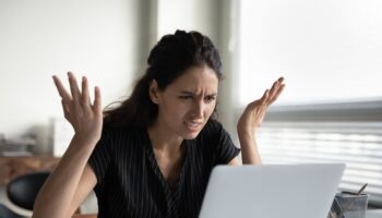 What is wrong. Anxious angry hispanic female splash hands unable to access database on laptop forgetting password having weak wifi signal. Mad shocked young woman worker losing job result on broken pc