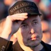 FILE - Tesla and SpaceX CEO Elon Musk listens as Republican presidential nominee former President Donald Trump speaks at a campaign event at the Butler Farm Show, on Oct. 5, 2024, in Butler, Pa. (AP Photo/Alex Brandon, File)