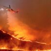 Water is dropped by helicopter on the Kenneth Fire in the West Hills section of Los Angeles, Thursday, Jan. 9, 2025. (AP Photo/Ethan Swope)