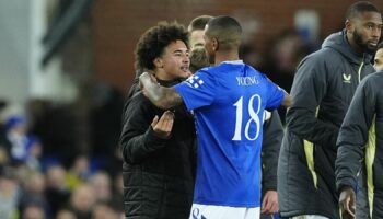 Ashley Young embraces son Tyler Young after full time. Pic: PA