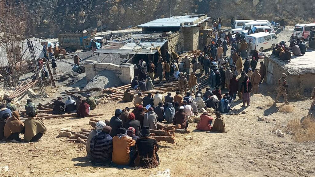 Local residents gather as rescuers conduct an operation to recover coal mine workers following a methane gas explosion caused a coal mine to collapse in Singidi, a remote area of southwest Pakistan's Balochistan province, Friday, Jan. 10, 2025. (AP Photo)