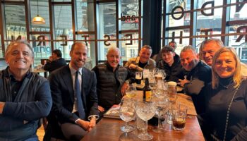 Prince William, second from left, with Aston Villa fans in Wetherspoons. Pic: PA