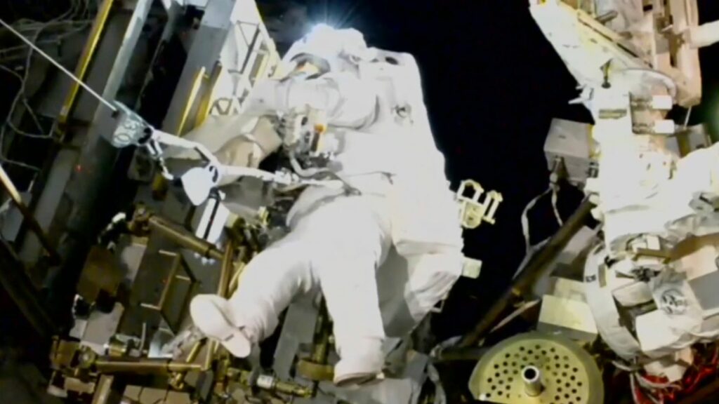 NASA's stuck astronaut steps out for spacewalk