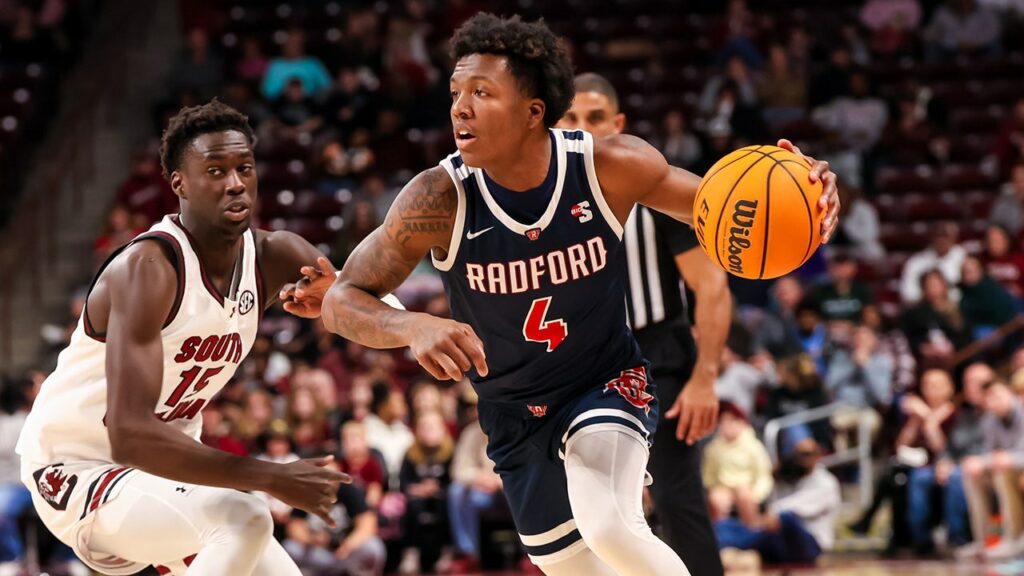 Young college basketball fan delays game after adorably storming the court: ‘Don’t know who’s child that is’