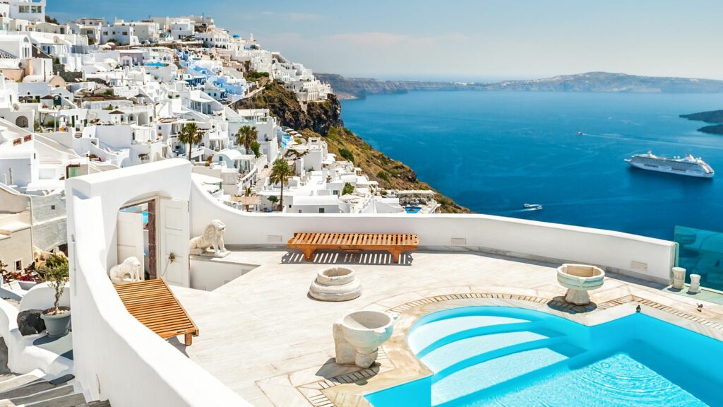 White architecture on Santorini island, Greece. Swimming pool in luxury hotel. Beautiful view on the sea. Pic: iStock