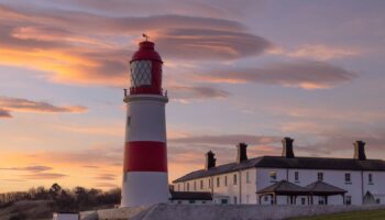 Lenticular clouds spotted over a lighthouse in the north east of England. Pic: AP