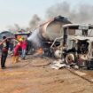 Fuel explosion kills 70 as crowd 'scooped fuel' from overturned tanker