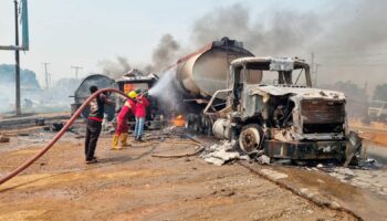 Fuel explosion kills 70 as crowd 'scooped fuel' from overturned tanker