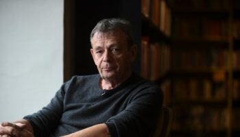 French writer Pierre Lemaitre poses during an interview with AFP in Bogota on April 28, 2017. (Photo by Raul ARBOLEDA / AFP)