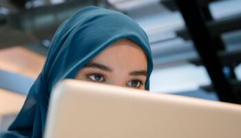 Arab businesswoman using a laptop