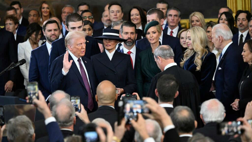 Mr Trump is sworn in by Chief Justice Roberts. Pic: AP