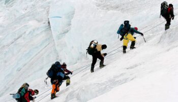 An expedition team climbing Mount Everest. Pic: AP