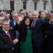 Fianna Fail leader Micheal Martin (centre) with his wife Mary outside Leinster House, Dublin, after he was selected as the new Taoiseach. Pic: PA