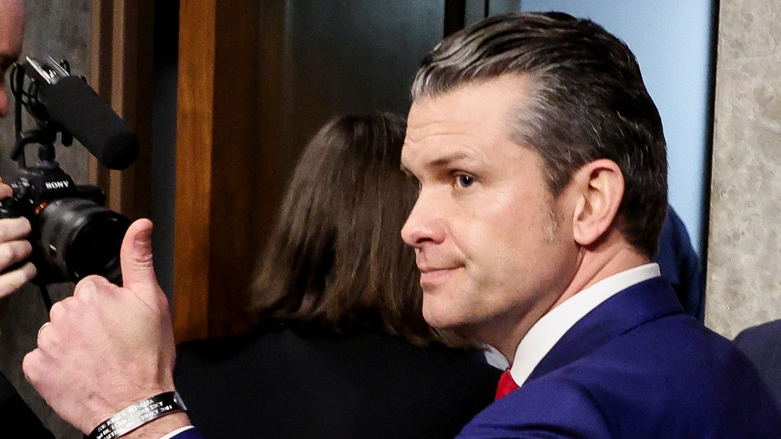 Pete Hegseth, U.S. President-elect Donald Trump's nominee to be secretary of defense, gives a thumbs-up as he leaves a Senate Committee on Armed Services confirmation hearing on Capitol Hill in Washington, U.S., January 14, 2025. REUTERS/Evelyn Hockstein