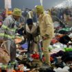 Security personnel assist a person after a stampede before the second "Shahi Snan" (grand bath) at the "Kumbh Mela" or the Pitcher Festival, in Prayagraj, previously known as Allahabad, India, January 29, 2025. REUTERS/Sharafat Ali