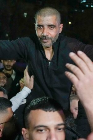 Zaharia Zubeidi , former leader of the Al-Aqsa Martyrs Brigade, an armed offshoot of the secular Fatah party, is greeted upon his arrival after being released from an Israeli prison in the West Bank city of Ramallah, Thursday Jan. 30, 2025.(AP Photo/Nasser Nasser)