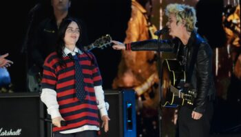 Billie Eilish, left, performs with Billie Joe Armstrong of Green Day during the FireAid benefit concert on Thursday, Jan. 30, 2025, at The Forum in Inglewood, Calif. (AP Photo/Chris Pizzello)