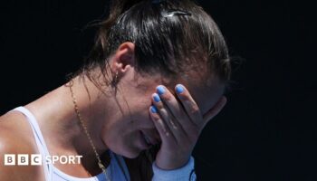 An emotional Jodie Burrage covers her face after beating Leolia Jeanjean in the Australian Open first round