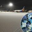 Britain's big freeze shuts four major airports with hundreds of flights disrupted as heavy snowfall continues to spark mayhem