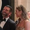 Don Jr. and his new girlfriend step out at Mar-a-Lago... as Trump speaks out on New Year's Eve from his celebrity-packed Florida fortress