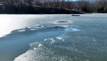 Drone search ends in tragedy after two children discovered trapped beneath frozen lake