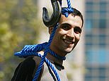 Extraordinary photo of brave Iranian smiling broadly with a noose round his neck moments before his execution for killing a notorious 'hanging judge' resurfaces after guard shot dead two supreme court justices reviled for condemning protestors to death