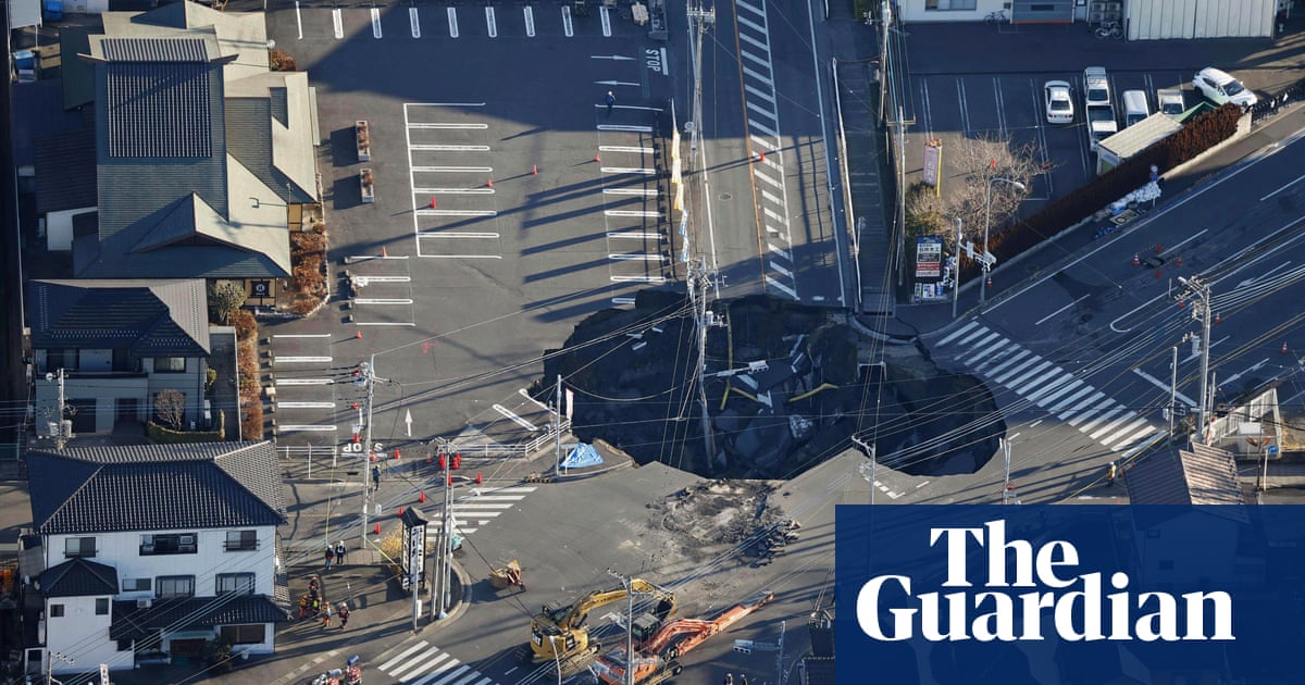 Fears grow in Japan for truck driver trapped in sinkhole for third day