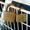 Heartbreak as dozens of engraved padlocks placed by lovers are cut off an iconic suspension bridge