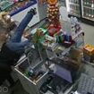 Moment bungling criminal tries to rob shop with toy gun while drunk - before falling over counter in bid to get vodka