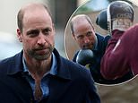 Prince William packs a punch as he spars during boxing class as he visits homeless charity