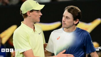 Jannik Sinner hugs Alex de Minaur after their Australian Open quarter-final