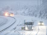 Snow travel chaos as crash-hit roads are closed, flights are cancelled in blizzard conditions and trains are delayed as Arctic blast blitzes Britain